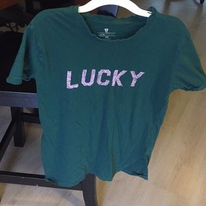 Green shirt with pink “lucky”